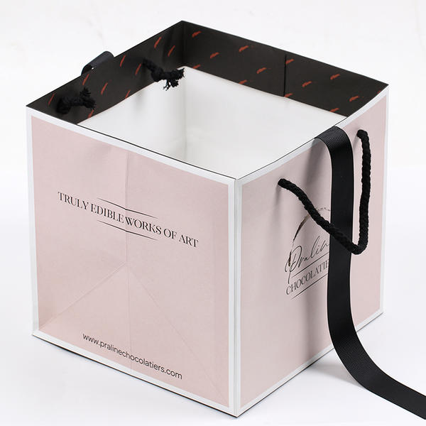 Bolsas de papel de regalo para compras al por menor de moda rosa cuadrada de lujo con impresión de logotipo personalizado con asa de cinta